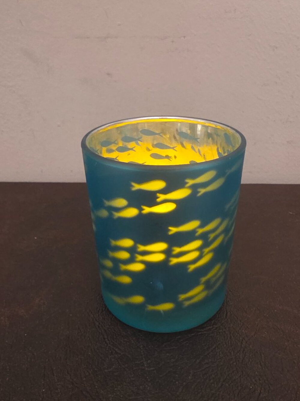 Minnows Candle Holder & Light is a rustic teal glass candle holder